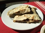 A cheese quesadilla with chicken. A cheese quesadilla with chicken.