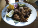 Cochinita pibil - a slow-roasted pork served with frijoles, onion and avocado. Cochinita pibil - a slow-roasted pork served with frijoles, onion and avocado.