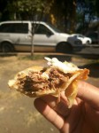 Mexican empanadas con carne - Mexican fried dumplings with meat. Served with white cabbage and topped with cream. Mexican empanadas con carne - Mexican fried dumplings with meat. Served with white cabbage and topped with cream.