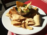A traditional guacamole served with fresh cheese and nachos. A traditional guacamole served with fresh cheese and nachos.