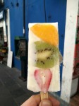 Natural yogurt ice creams with fruit slices - kiwi, mango and strawberry. Natural yogurt ice creams with fruit slices - kiwi, mango and strawberry.