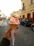 Three scoops of homemade ice creams - walnut, strawberry and nougat. Three scoops of homemade ice creams - walnut, strawberry and nougat.