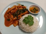 Red curry paste with fried young coconut and basil leaves served with rice Red curry paste with fried young coconut and basil leaves served with rice