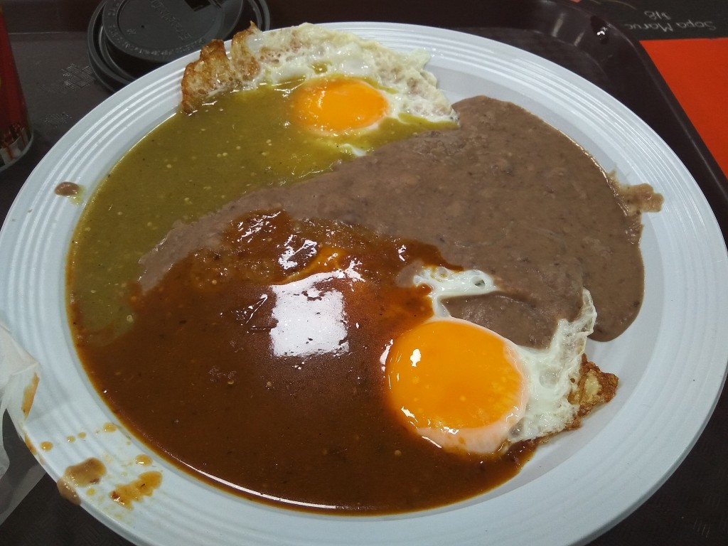 Huevos divorciados con salsa verde y roja y frijoles - Rancher's eggs with red and green salsa and fried beans. Huevos divorciados con salsa verde y roja y frijoles - Rancher's eggs with red and green salsa and fried beans.