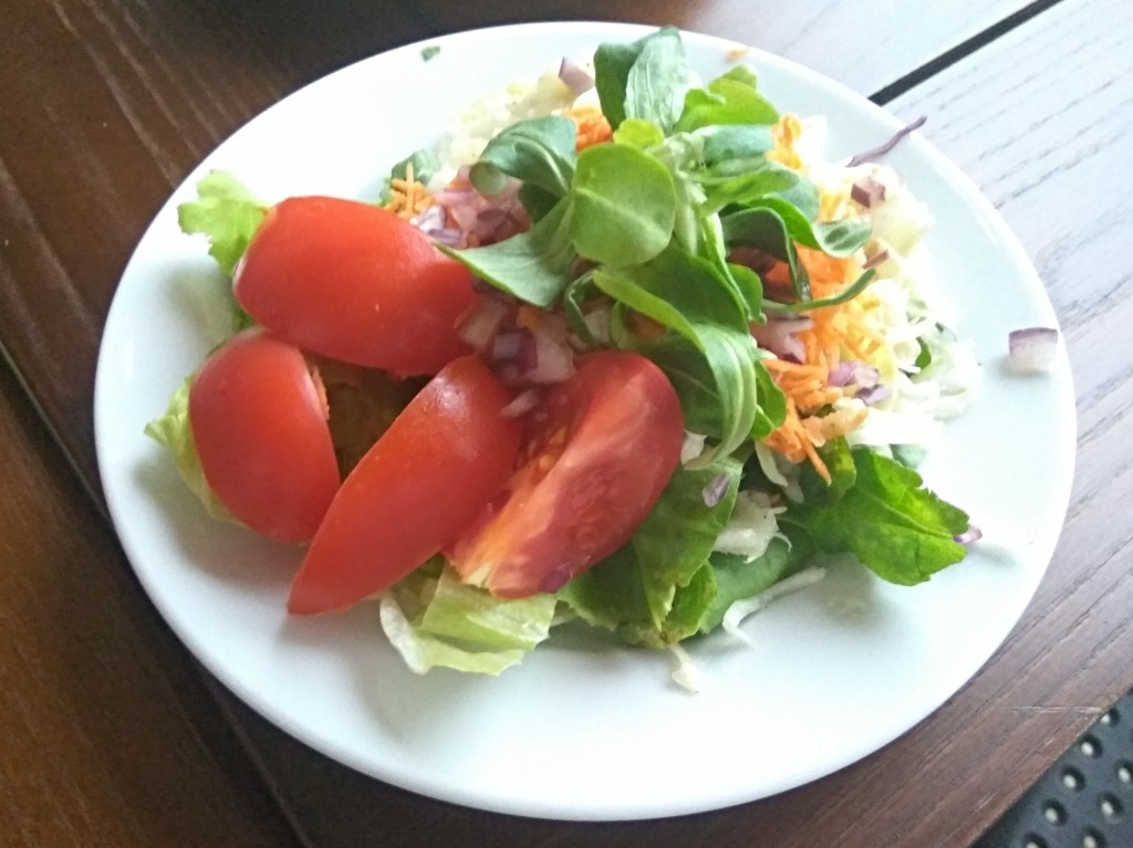 Enormous Wiener schnitzel with French fries and a salad mix. Enormous Wiener schnitzel with French fries and a salad mix.