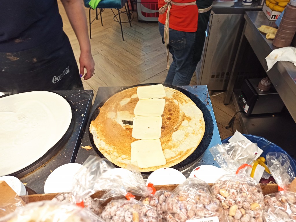 Take mozzarella slices and place them in the middle part from the top till the bottom of your pancake.  Take mozzarella slices and place them in the middle part from the top till the bottom of your pancake.