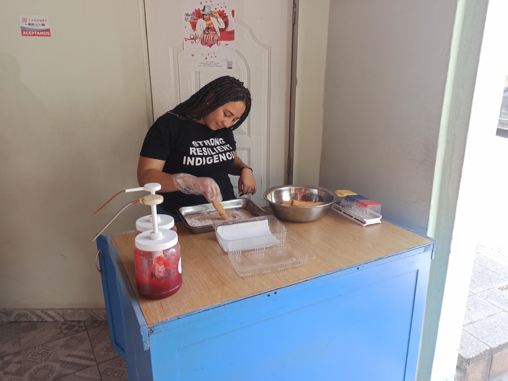 Garnishing churros Garnishing churros
