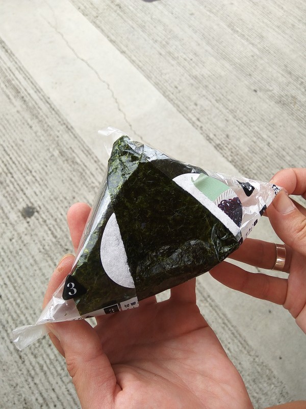 Unpacking an onigiri. Unpacking an onigiri.