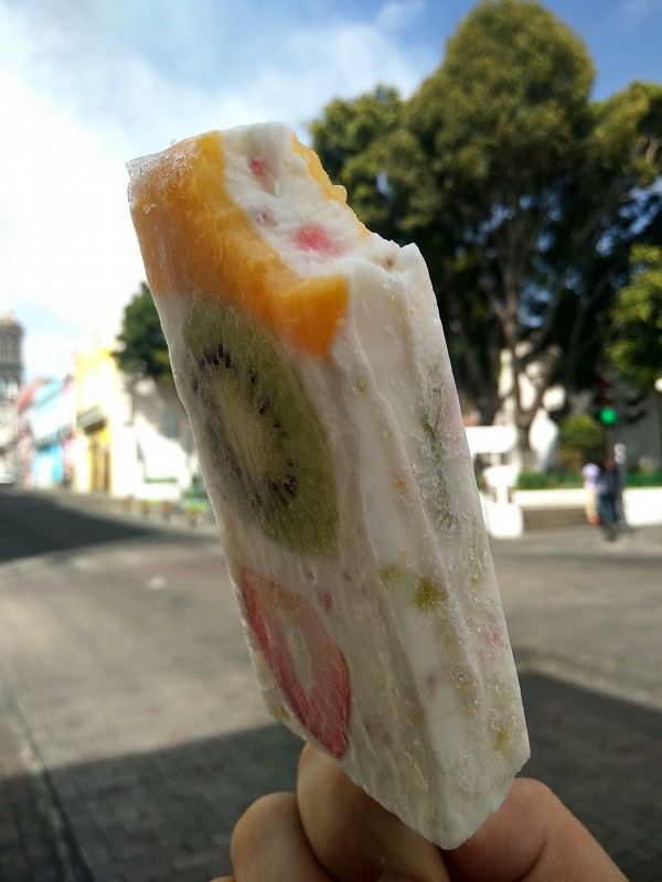 Natural yogurt ice creams with fruit slices - kiwi, mango and strawberry. Natural yogurt ice creams with fruit slices - kiwi, mango and strawberry.