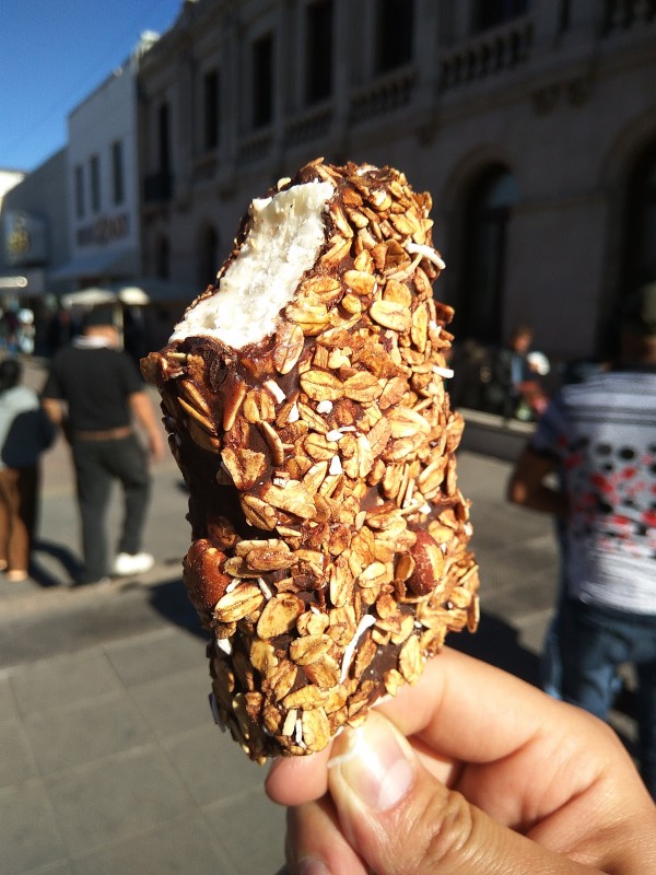 Vanilla ice creams in chocolate with oats and nuts. Vanilla ice creams in chocolate with oats and nuts.